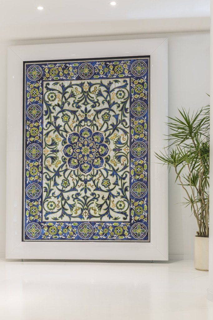 A custom glass mosaic based on ancient Iznik porcelain patterns highlights AKDO's new showroom.