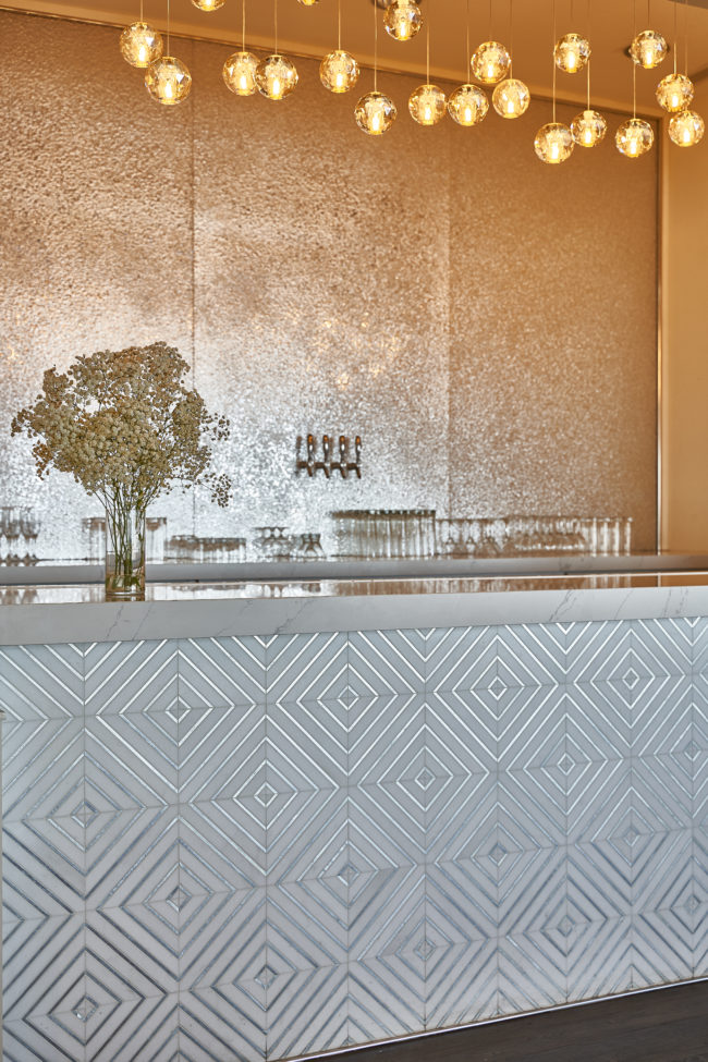 Maximalism in Hospitality Design. Bar Design. Gold Walls. Metallic Tile. 