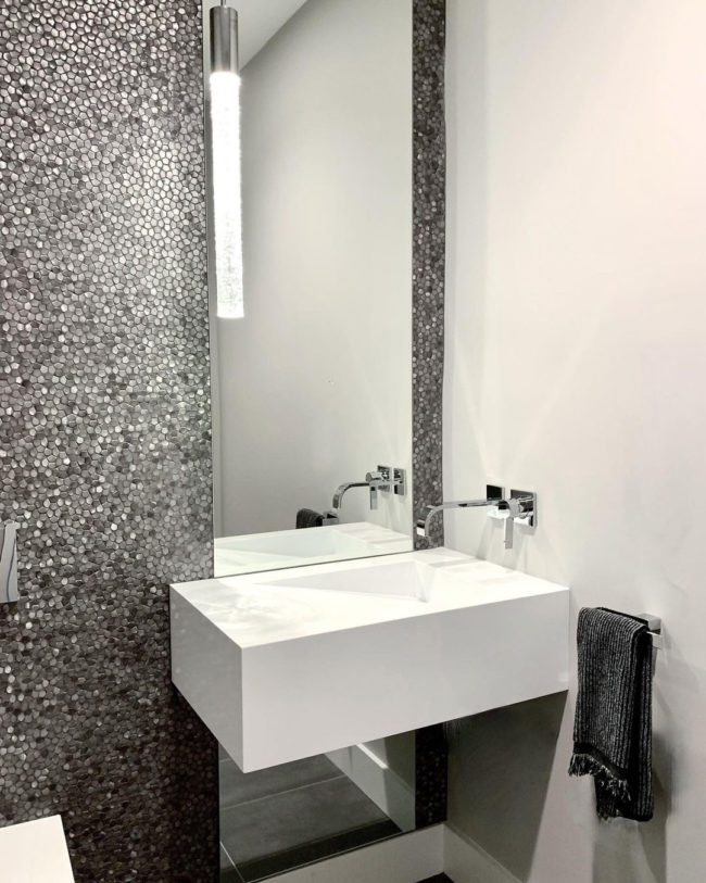 Silver metal mosaic tile on powder room vanity backsplash 